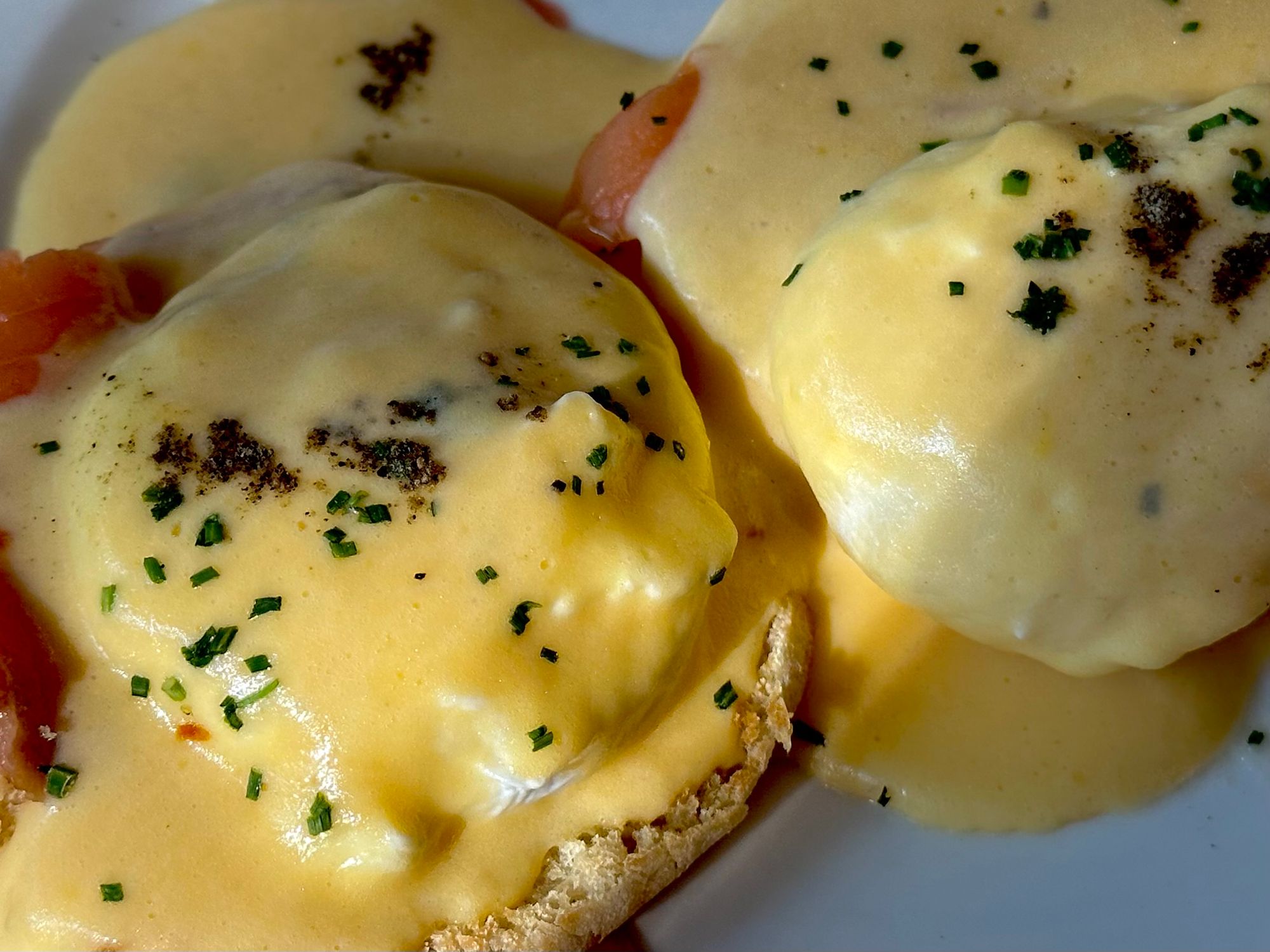 A Delectable Encounter: Savoring Eggs Benedict with Smoked Salmon at a Charming Brunch Spot